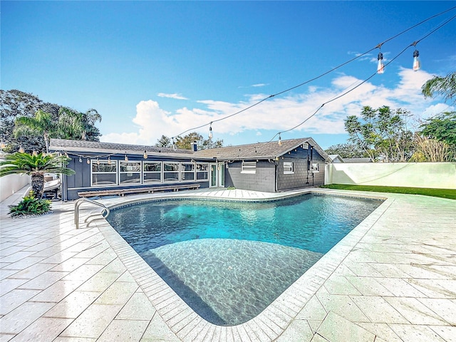 view of pool featuring fence, a fenced in pool, and a patio