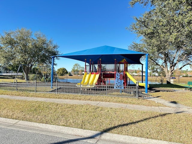 view of jungle gym with a water view