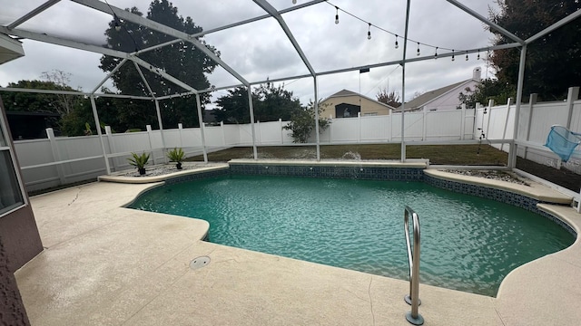 view of swimming pool with a patio and a lanai