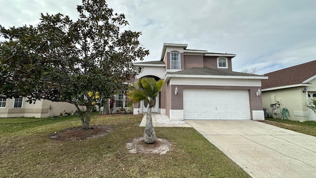 view of front of property with a front yard and a garage