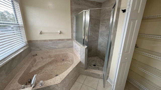 bathroom with plus walk in shower and tile patterned floors