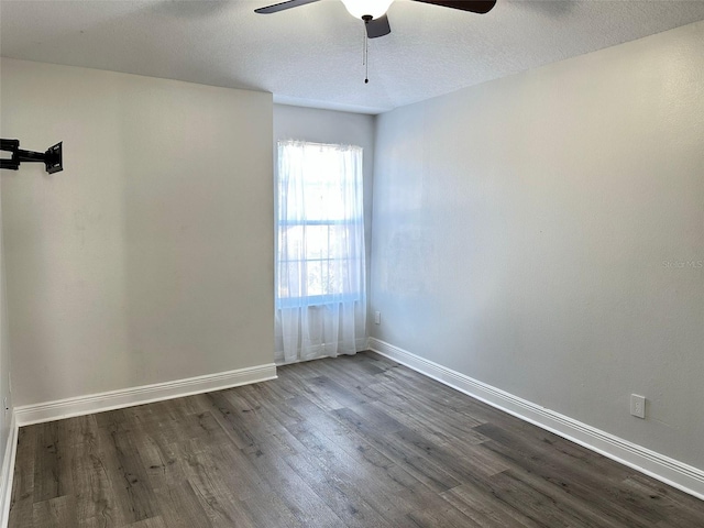 unfurnished room featuring a textured ceiling, ceiling fan, and dark wood-type flooring