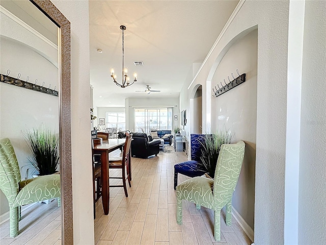 hallway featuring a chandelier