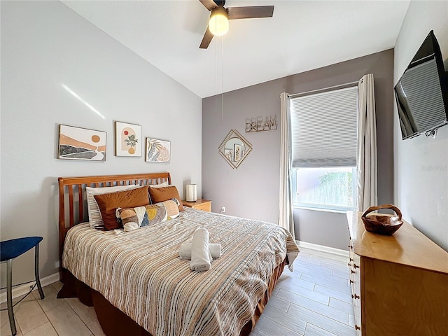 bedroom featuring ceiling fan and vaulted ceiling