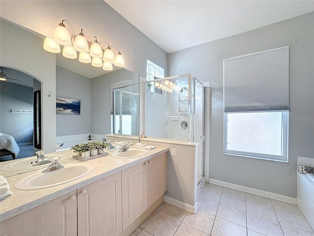 bathroom with shower with separate bathtub, vanity, tile patterned floors, and ceiling fan