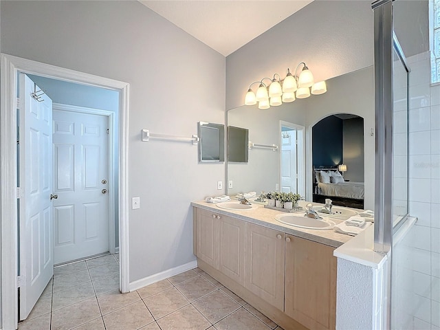 bathroom with tile patterned flooring and vanity