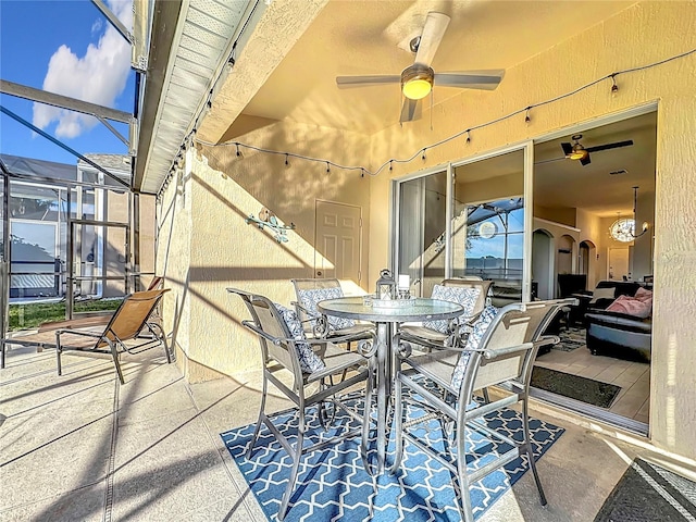 view of patio / terrace with glass enclosure and ceiling fan