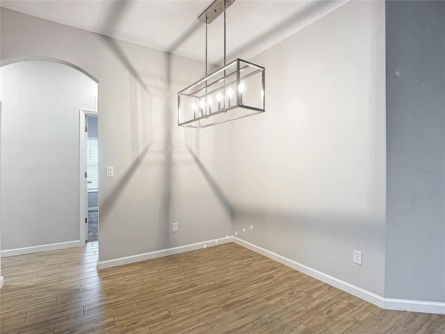 unfurnished room featuring hardwood / wood-style floors