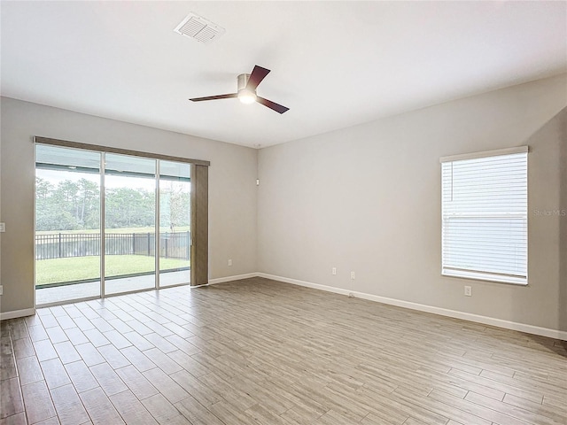 unfurnished room featuring ceiling fan and light wood-type flooring