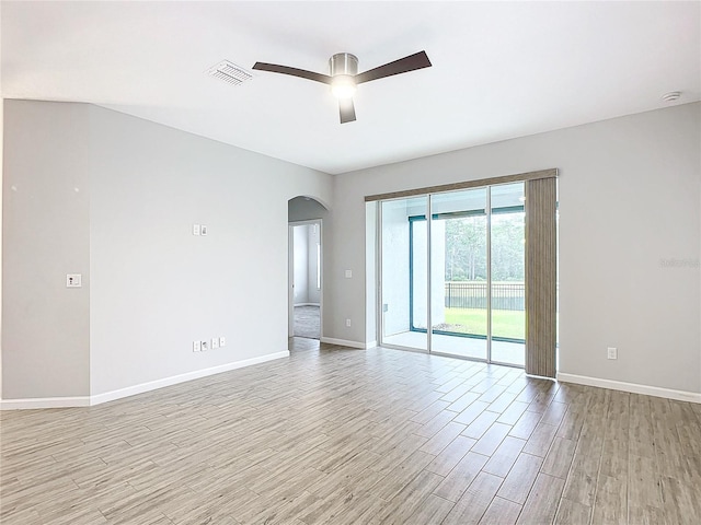 spare room with ceiling fan and light hardwood / wood-style floors