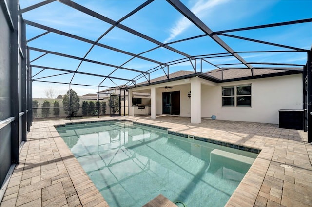 view of pool featuring a lanai, ceiling fan, and a patio area