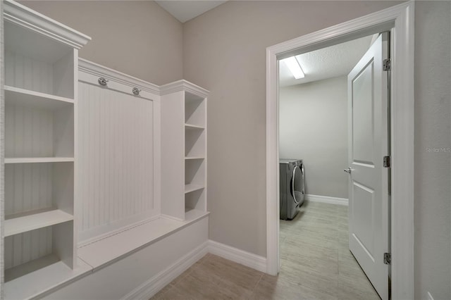 mudroom with washing machine and clothes dryer