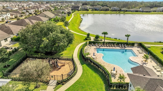 view of swimming pool featuring a water view