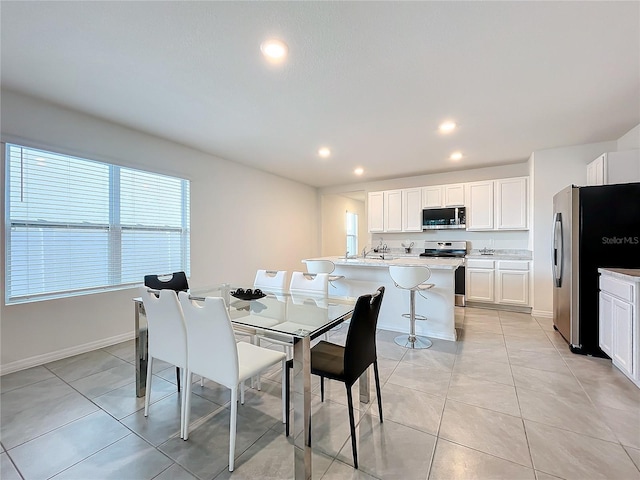 dining space with light tile patterned flooring