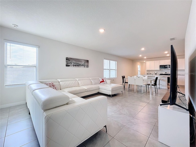 living room with light tile patterned floors