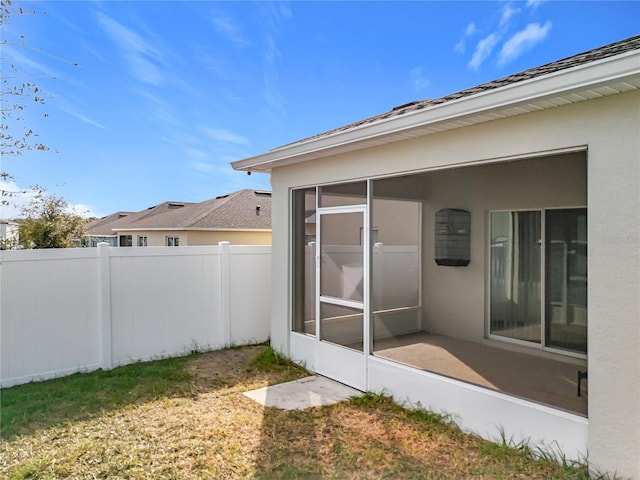 view of yard with a sunroom