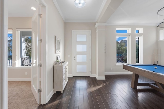 foyer entrance featuring dark hardwood / wood-style flooring, crown molding, and pool table