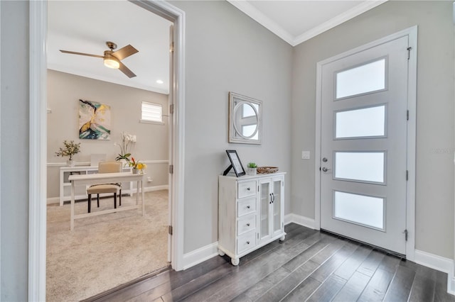 entrance foyer featuring ceiling fan, crown molding, and dark wood-type flooring