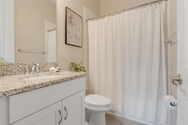 bathroom with tile patterned flooring, vanity, toilet, and a shower with curtain