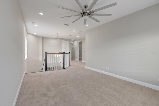 carpeted empty room with ceiling fan