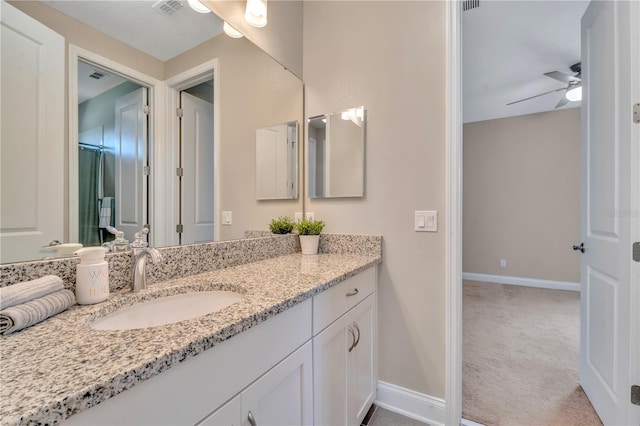 bathroom with ceiling fan and vanity