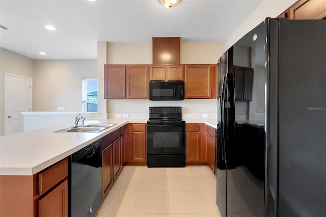 kitchen featuring black appliances, light tile patterned flooring, kitchen peninsula, and sink