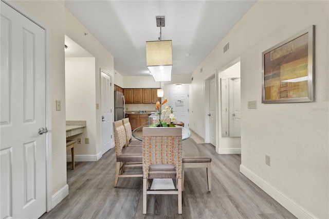 dining area featuring light hardwood / wood-style floors