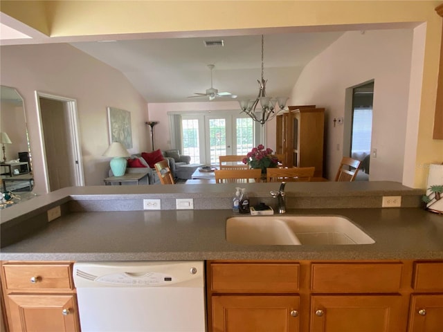 kitchen with french doors, ceiling fan with notable chandelier, white dishwasher, vaulted ceiling, and sink