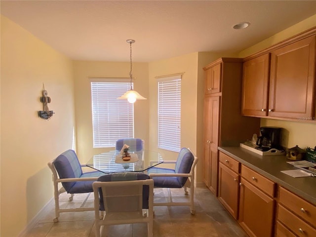 dining area with light tile patterned floors