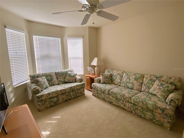 living room with carpet flooring and ceiling fan