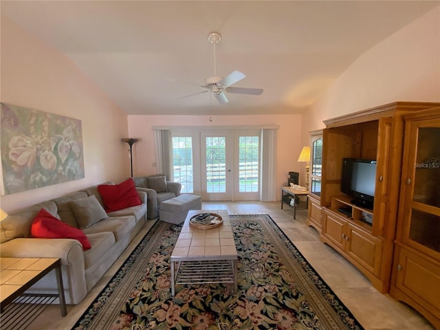 tiled living room with french doors, vaulted ceiling, and ceiling fan