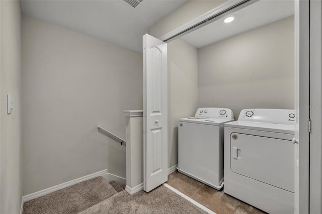 washroom featuring washer and clothes dryer