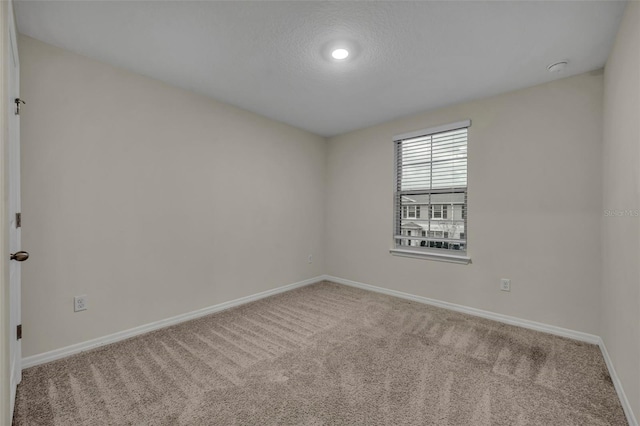 unfurnished room featuring carpet flooring