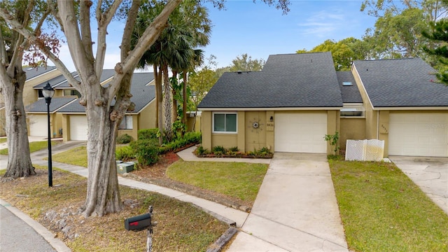 view of front facade featuring a garage and a front lawn