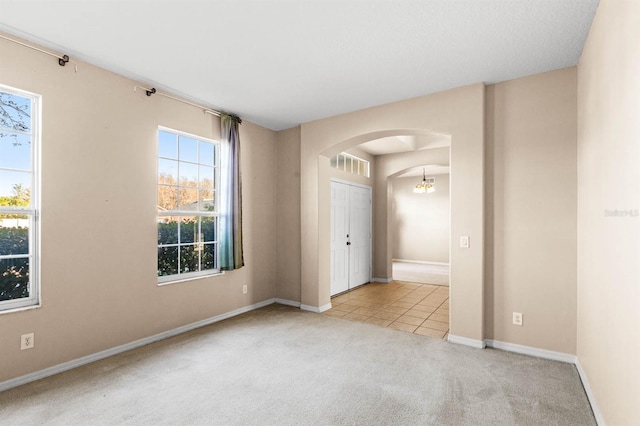 empty room with light colored carpet