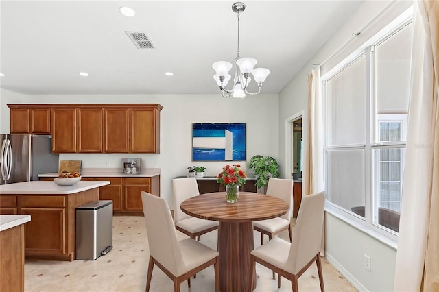 dining area with a notable chandelier