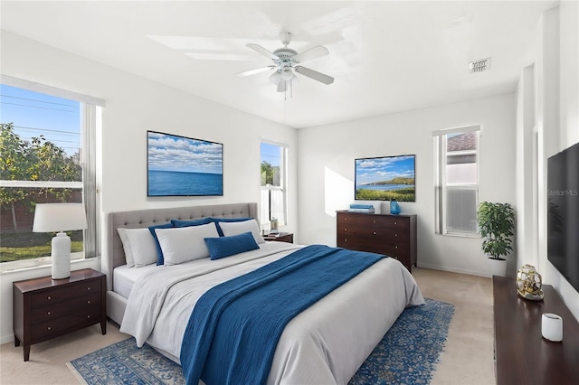 carpeted bedroom featuring ceiling fan