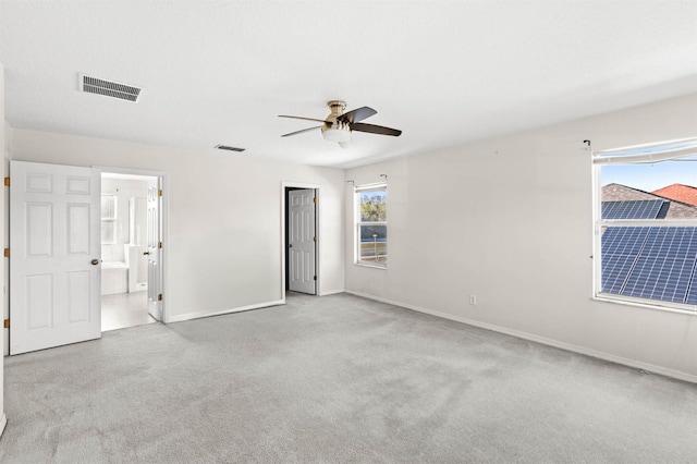 spare room with ceiling fan