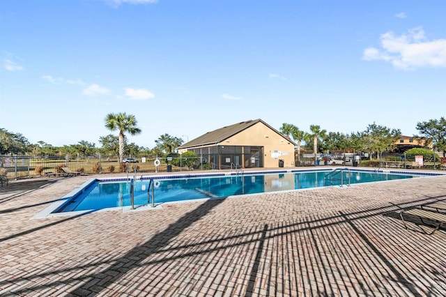 view of swimming pool with a patio area