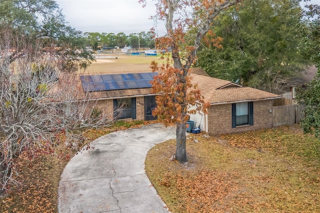 view of front of house with solar panels