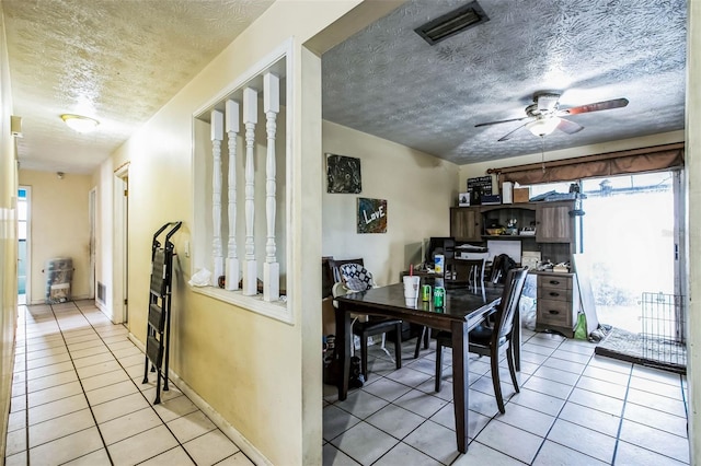 dining room with ceiling fan, plenty of natural light, and light tile patterned floors