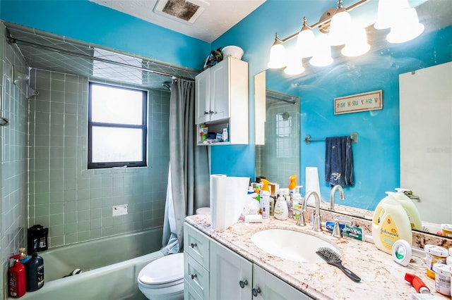 full bathroom with vanity, toilet, and shower / tub combo