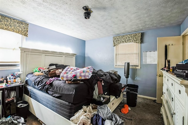 bedroom featuring a textured ceiling