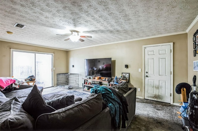 carpeted living room featuring ceiling fan, a textured ceiling, and ornamental molding