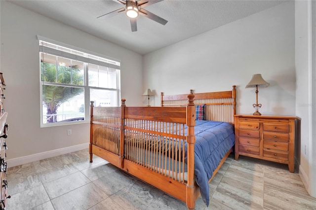 bedroom featuring ceiling fan and a textured ceiling