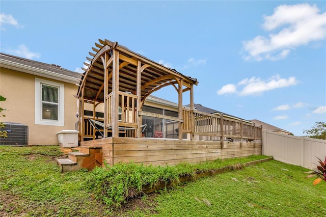 wooden deck featuring central AC unit