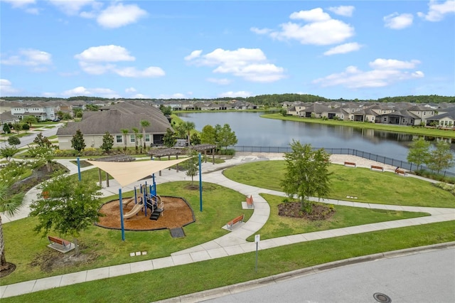 view of community featuring a water view and a playground