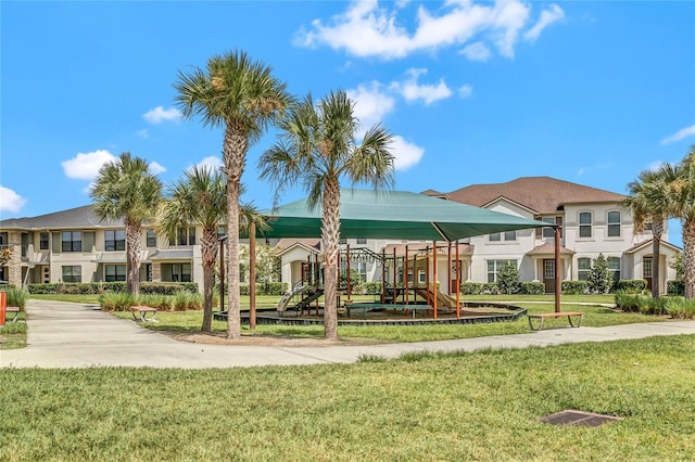 exterior space with a playground and a yard