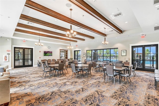 dining space featuring carpet floors, french doors, beamed ceiling, and an inviting chandelier