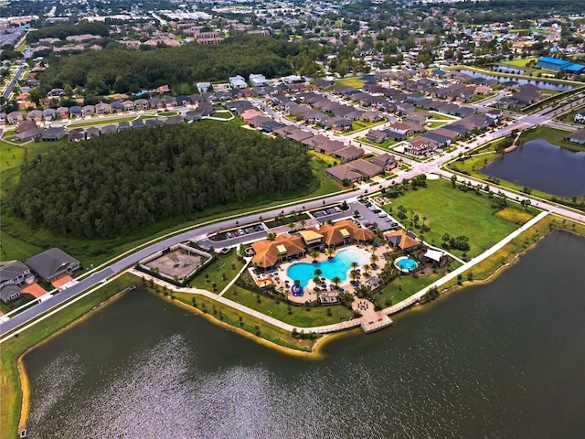 birds eye view of property with a water view